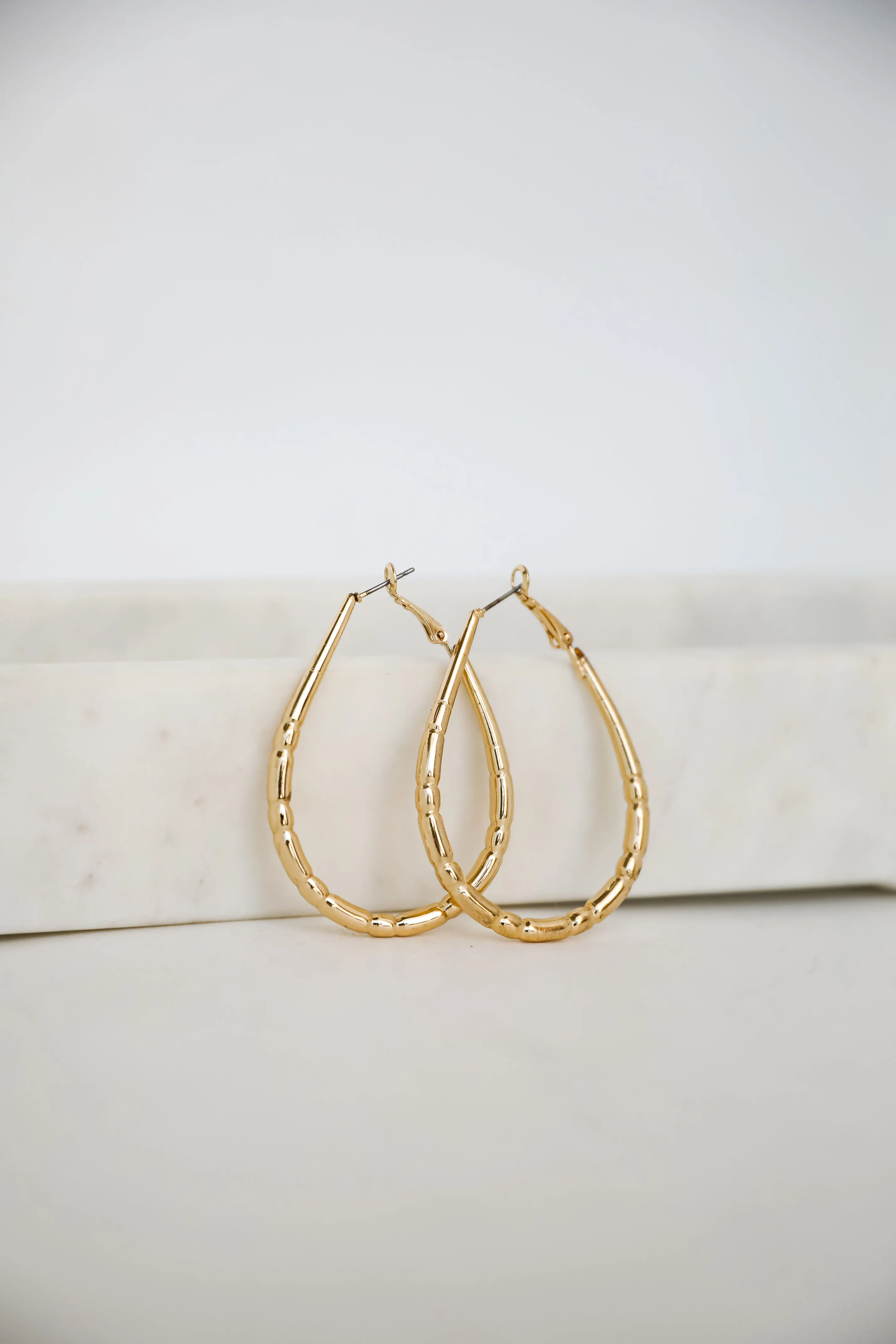 Brielle Gold Textured Teardrop Hoop Earrings