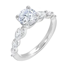 Round solitaire meets graduating pear cut diamonds set in common prongs blending classic elegance with contemporary style.