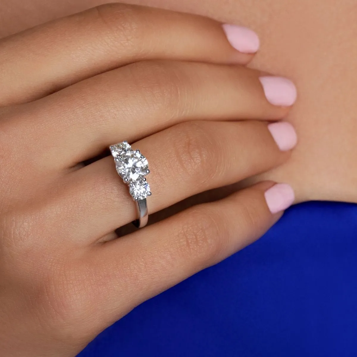 THREE STONE ROUND SOLITAIRE RING